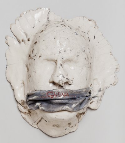 ceramics sculpture of gagged face