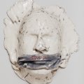 ceramics sculpture of gagged face